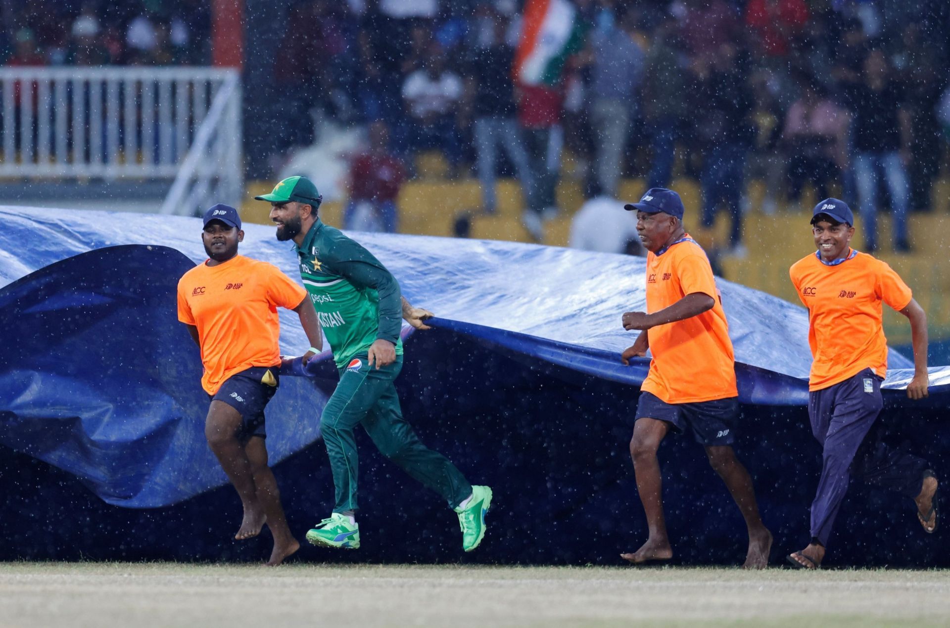 Pakistan opener Fakhar Zaman helping the support staff in Colombo. 