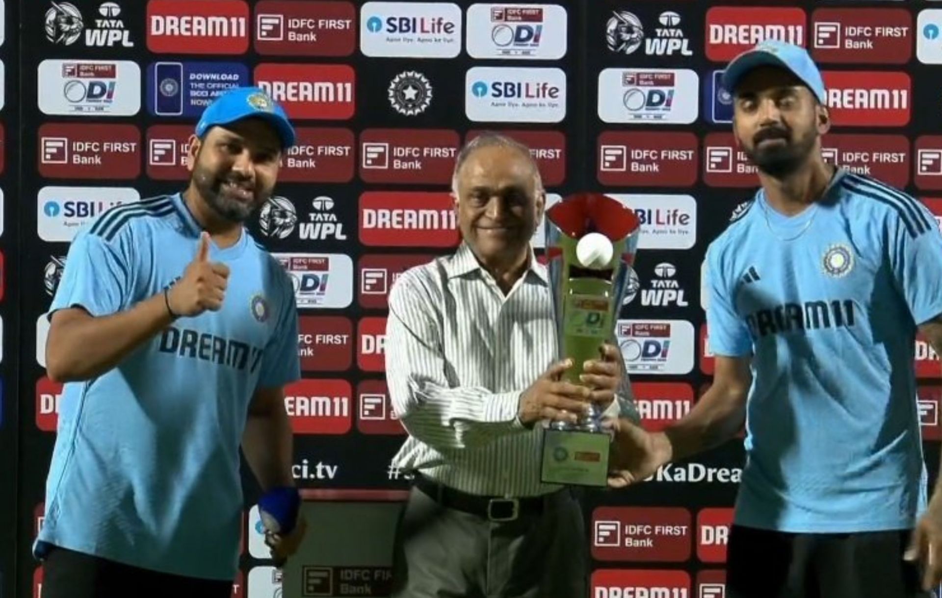 Rohit Sharma asks KL Rahul to accept the trophy after winning the series against Australia. 