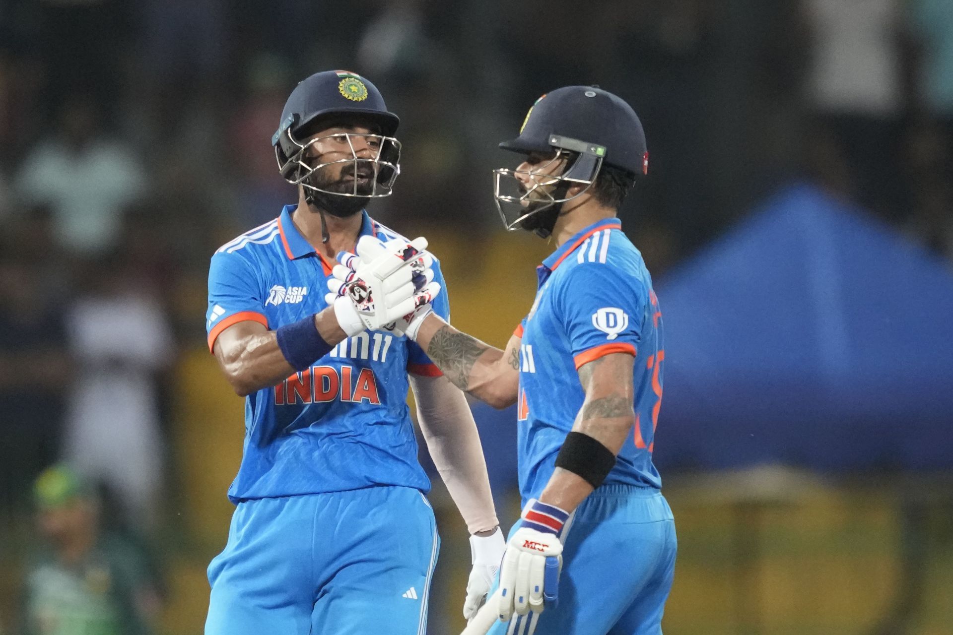 Virat Kohli (right) and KL Rahul build on the solid platform laid by the openers. Resuming at their overnight scores of 8 and 17 respectively, the duo went on to add an unbroken 233 runs for the third wicket as India posted an imposing 356/2 on the board. (Pic: AP Photo/Eranga Jayawardena)