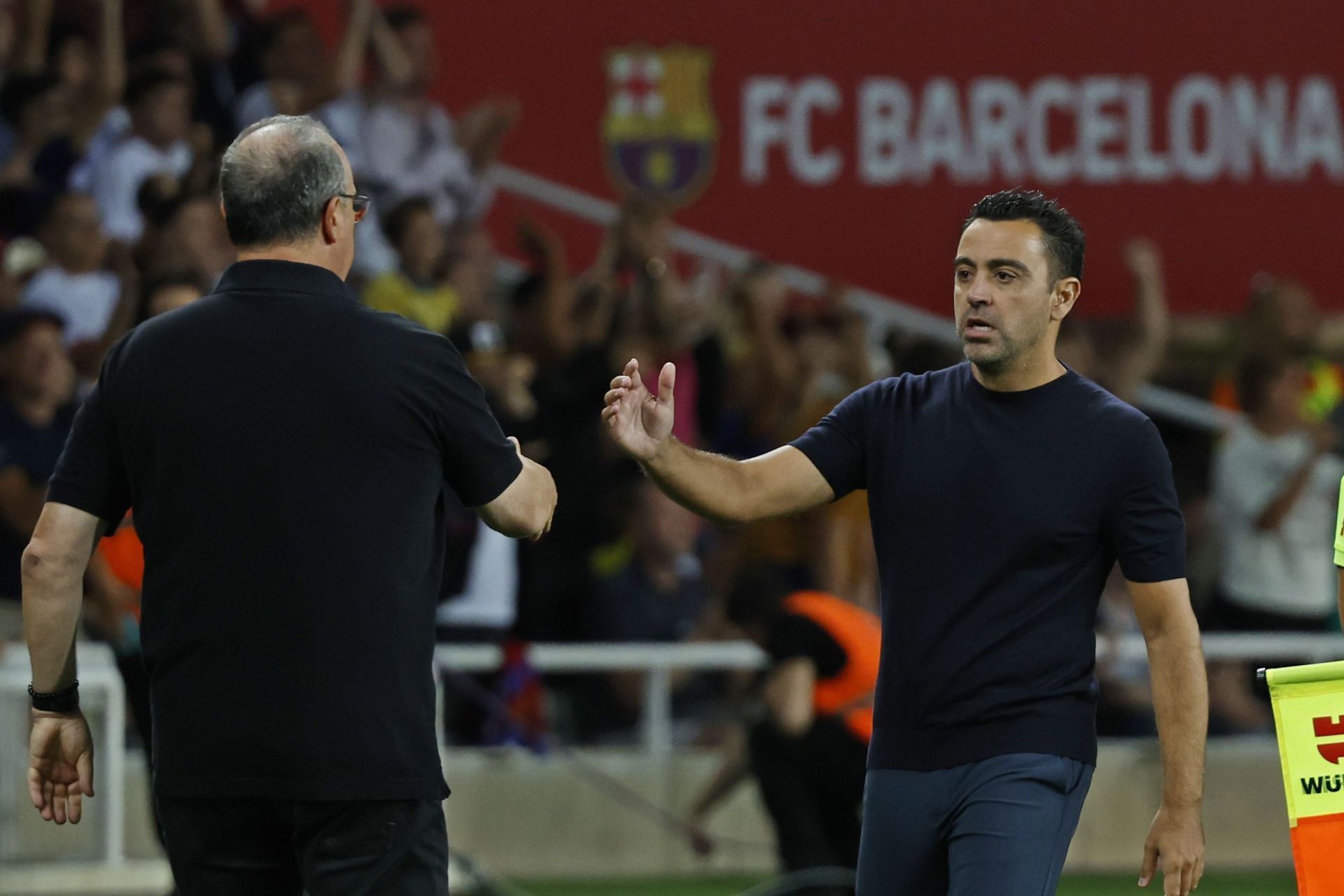 Barcelona boss Xavi (right)