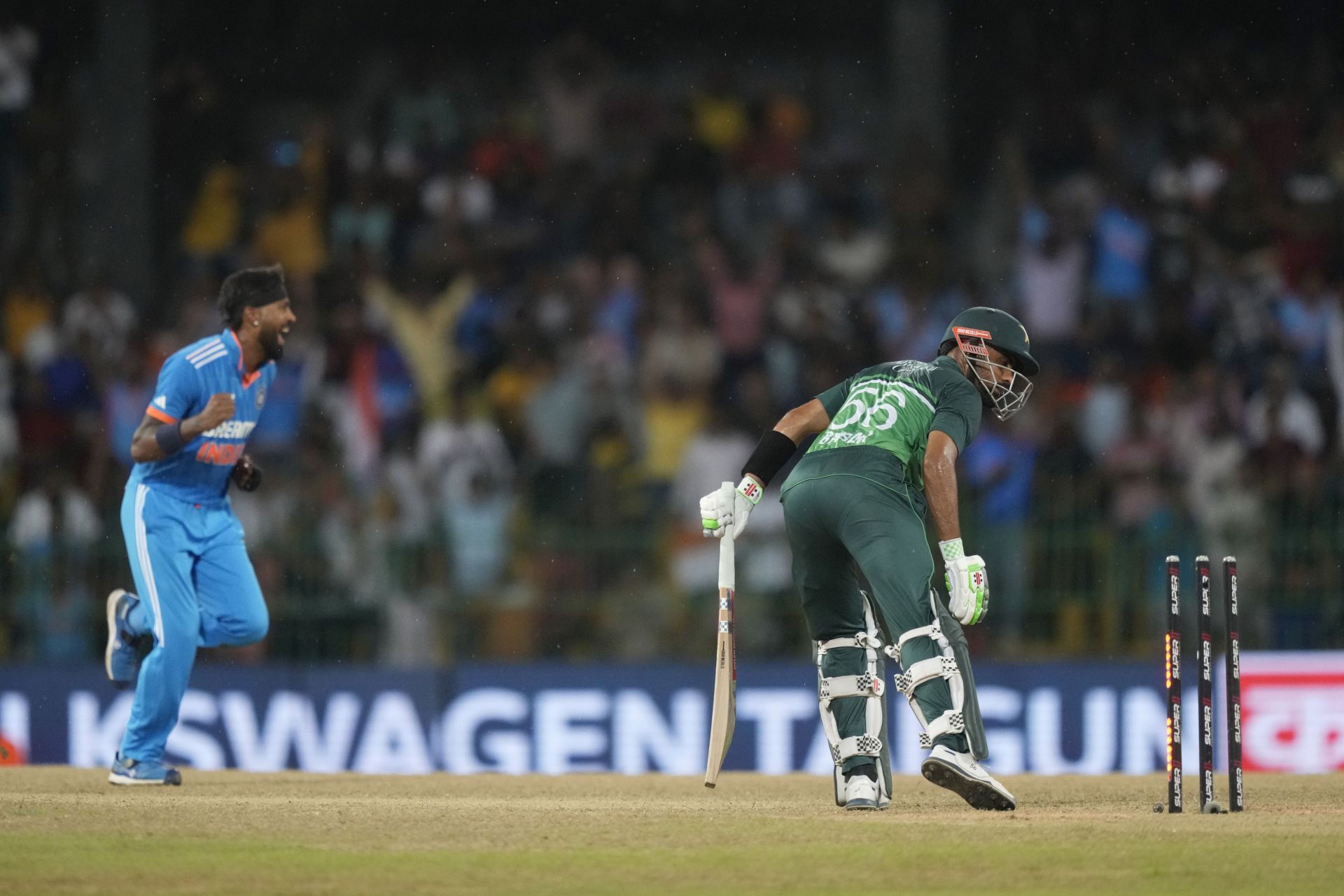Hardik Pandya got the massive scalp of Pakistan captain Babar Azam for 10, cleaning him up with a beauty - an inswinger that pitched outside off and nipped in sharply. (Pic: AP Photo/Eranga Jayawardena)