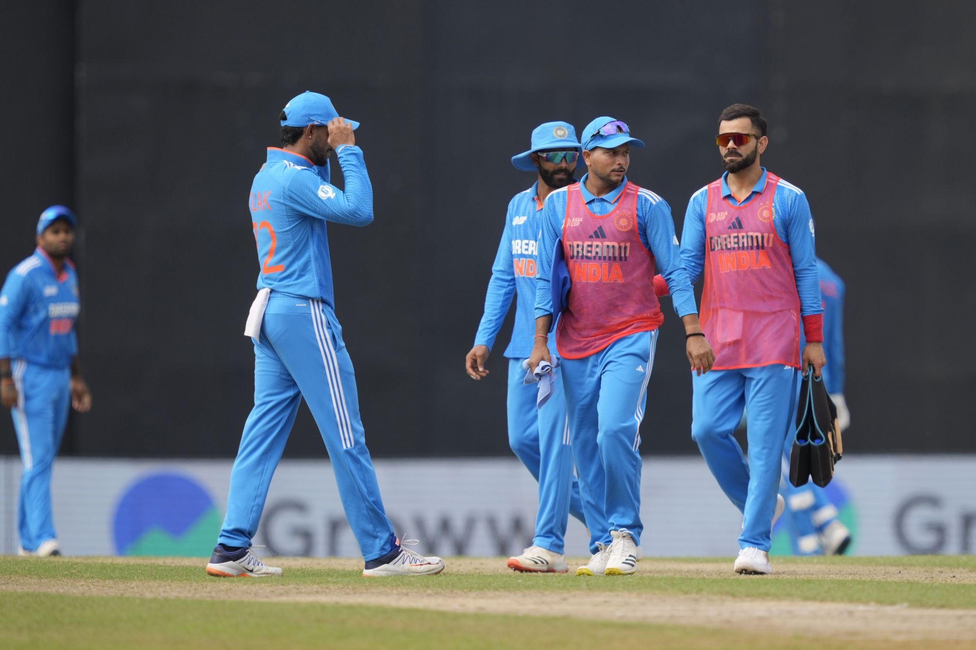 Virat Kohli [right] with a practice bib on has become a common sight