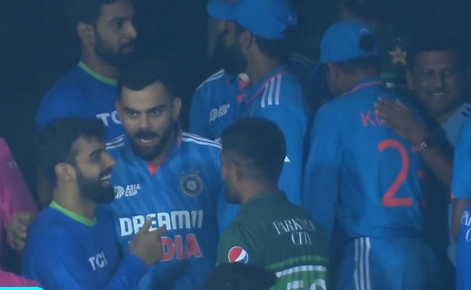 Indian and Pakistan players chatting after match was called off. 