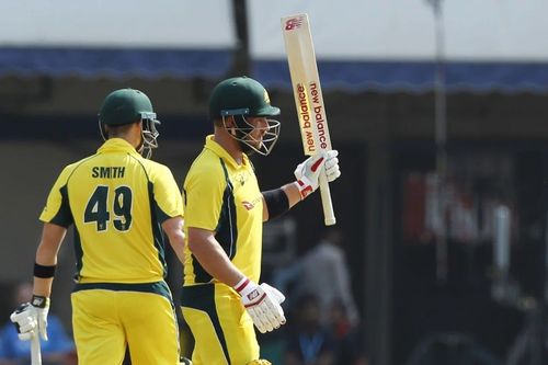 Aaron Finch raises his bat after a milestone [Getty Images]