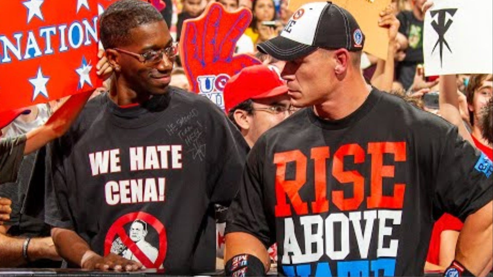 John Cena stands right next to a WWE fan.