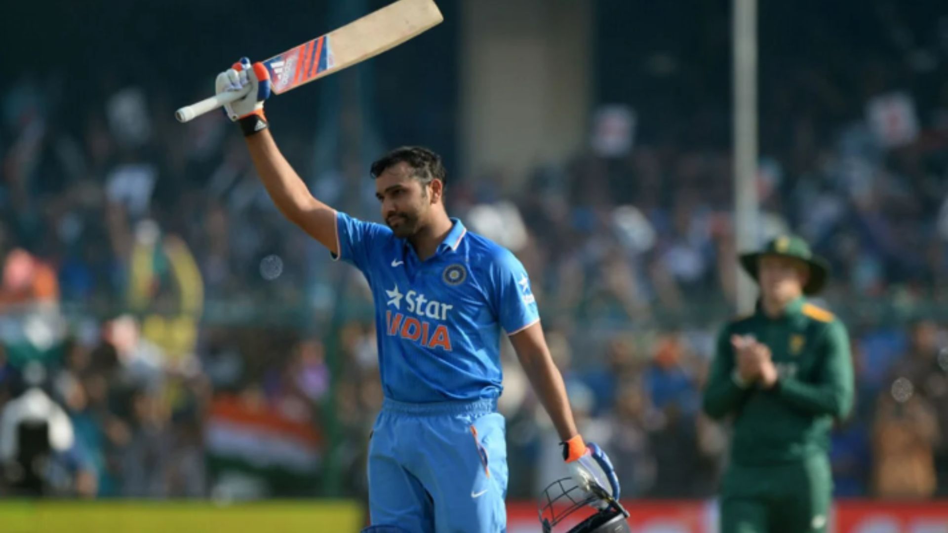Rohit Sharma raises his bat after scoring his 8th century against South Africa. (Pic:AFP)