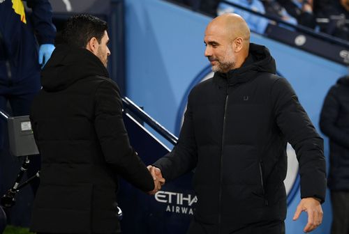 Pep Guardiola and Mikel Arteta (via Getty Images)