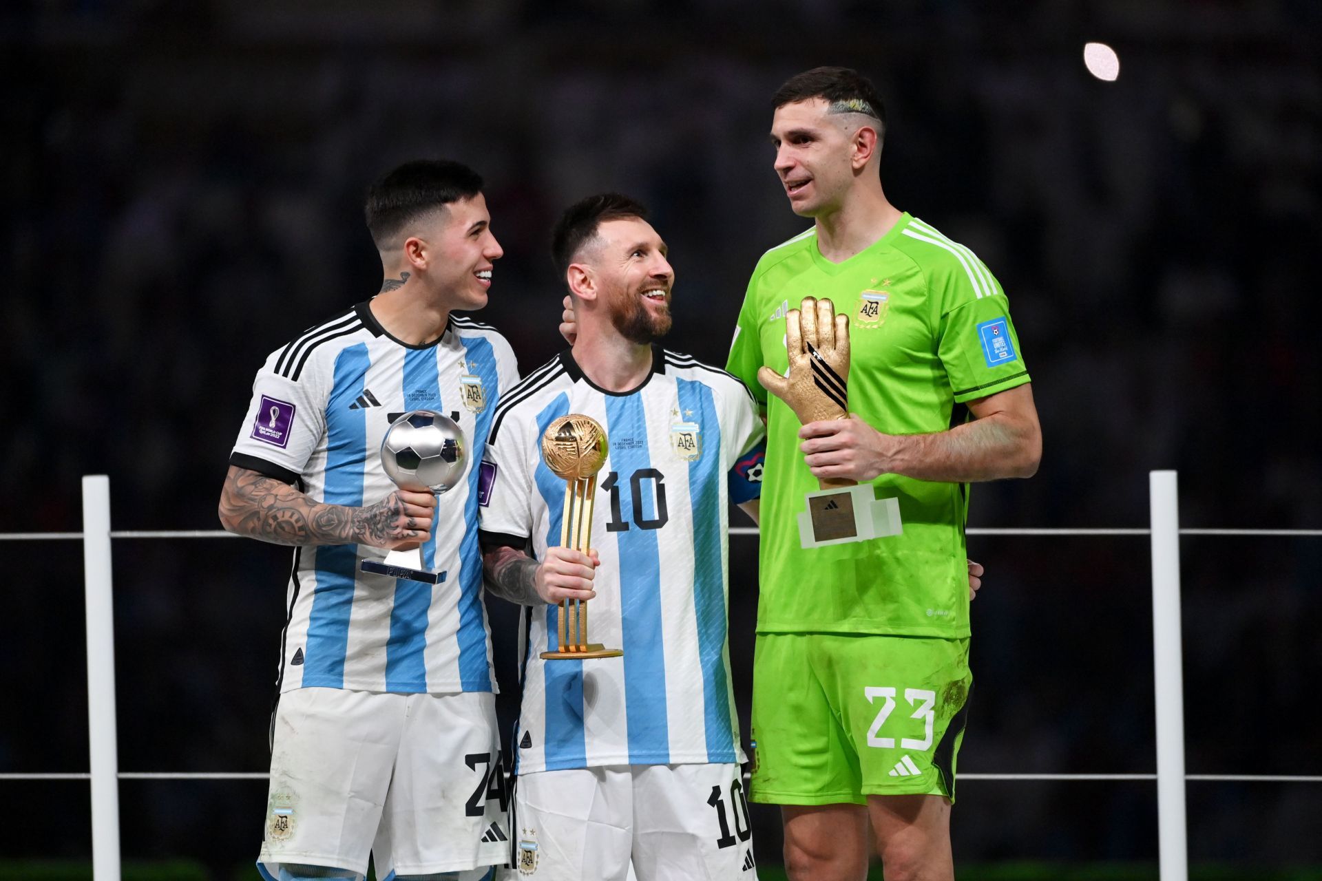 Emi Martinez (right) wants Lionel Messi (centre) to play the 2026 World Cup.