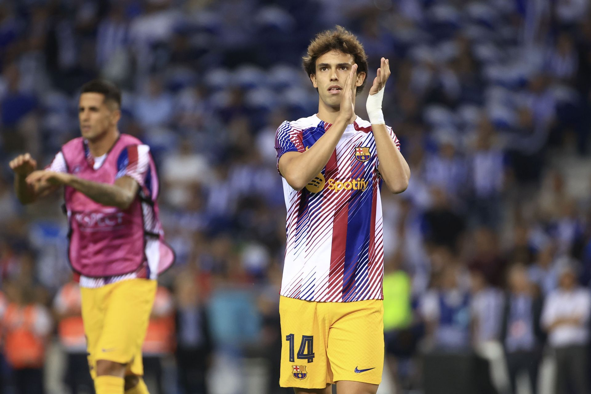 Joao Felix applauds the Barcelona fans following their Champions League game.