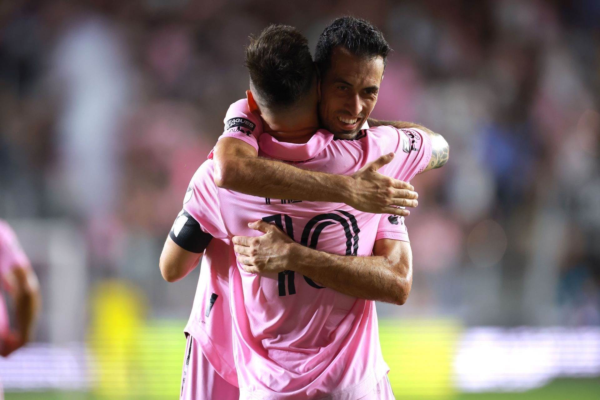 Lionel Messi and Sergio Busquets (via Getty Images)