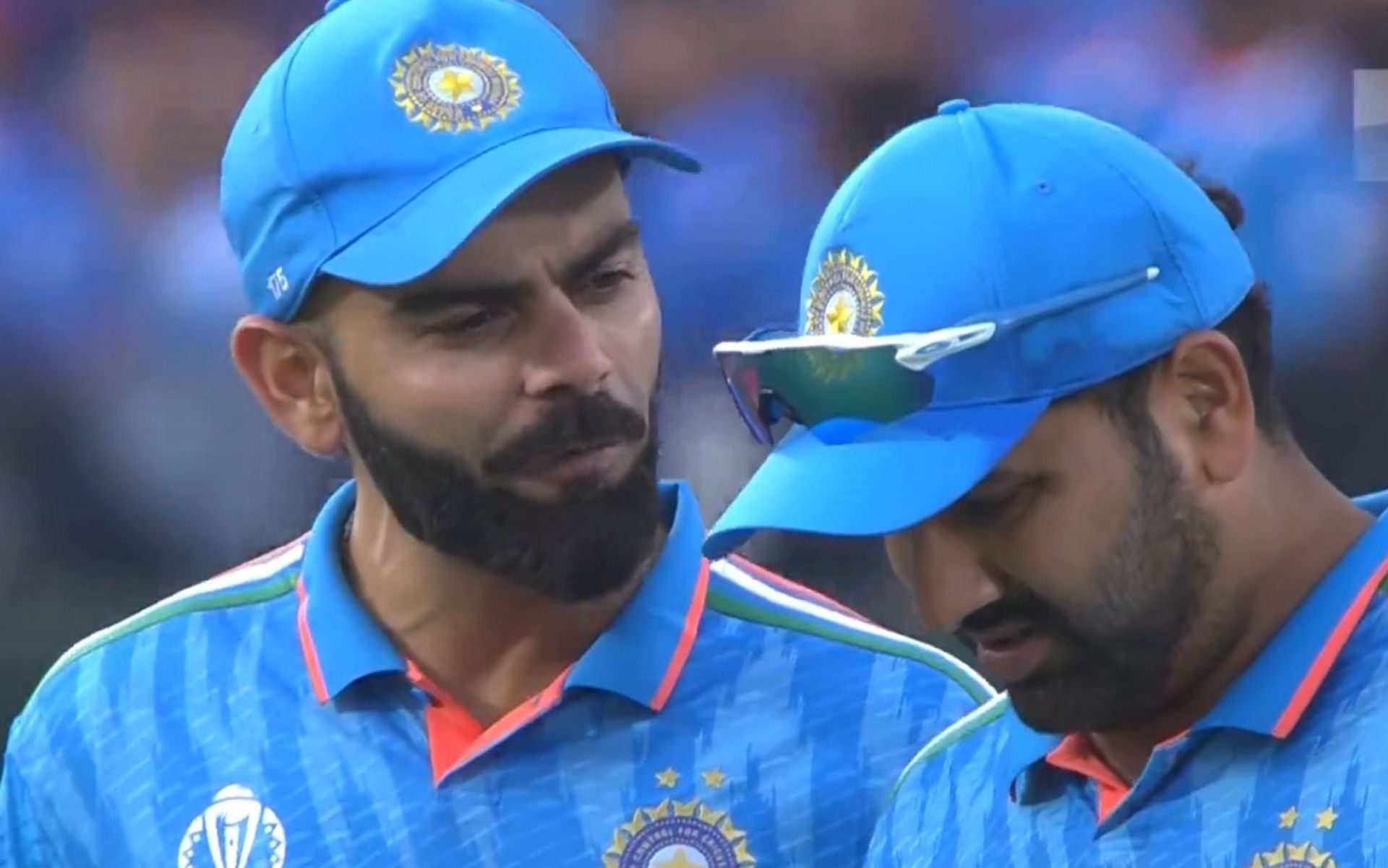Virat Kohli and Rohit Sharma chatting during the first innings on Sunday. 