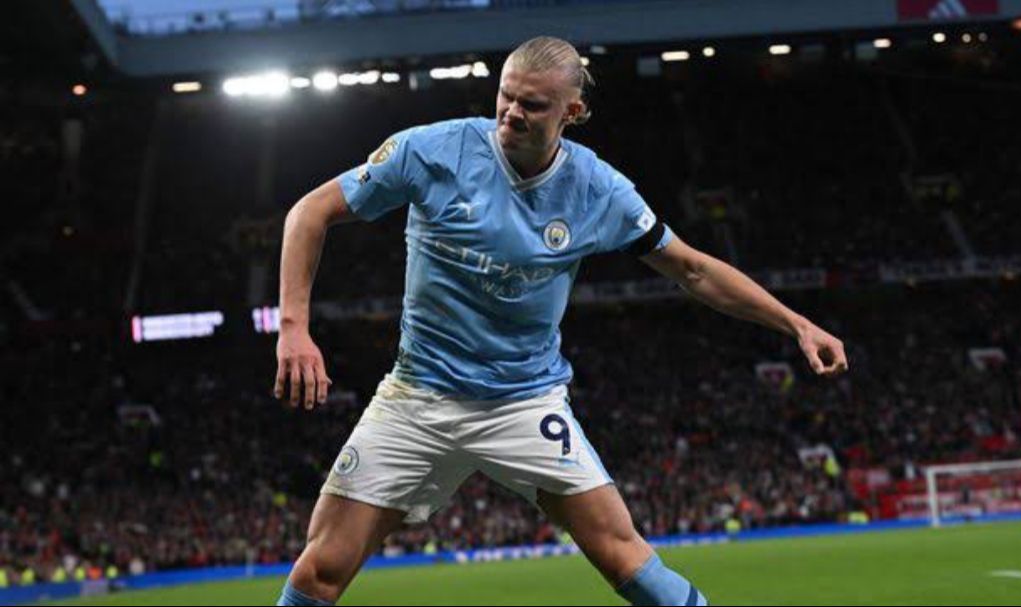 Erling Haaland celebrates after scoring one of his goals against Manchester United