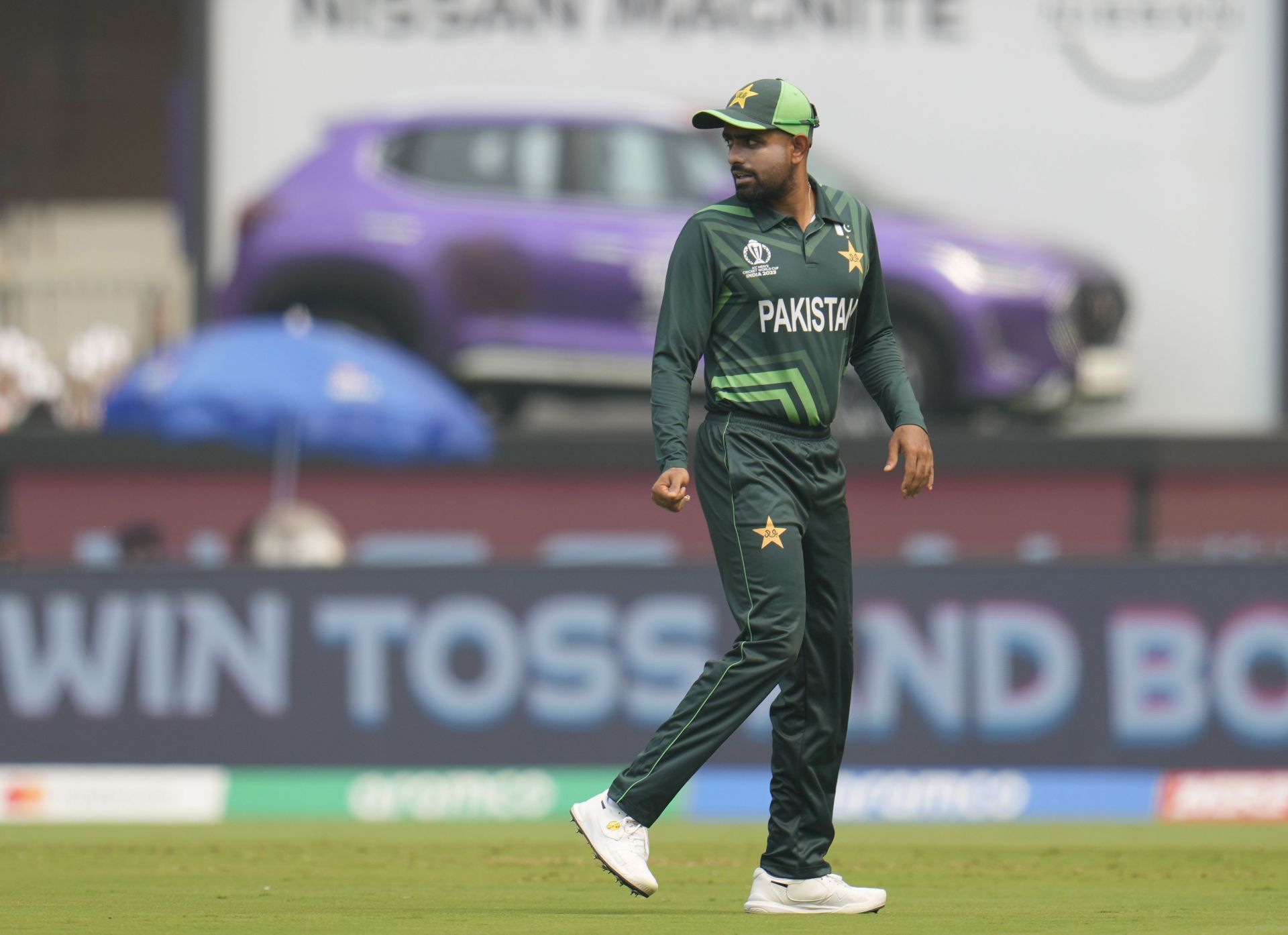 Pakistan captain Babar Azam leaves after the coin toss during the match against India. (Pic: AP)