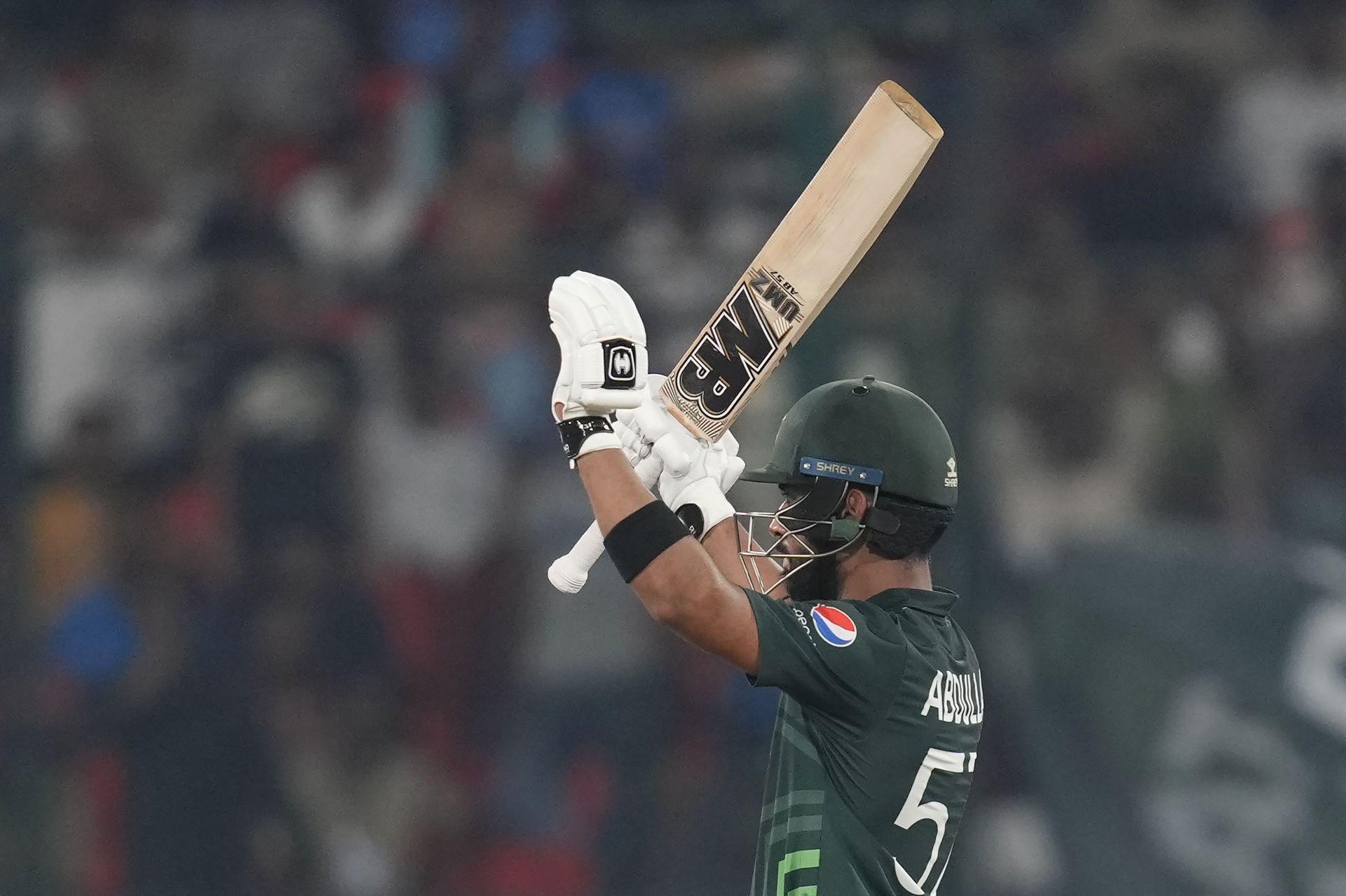 Abdullah Shafique raisinh his bat after his milestone [Getty Images]