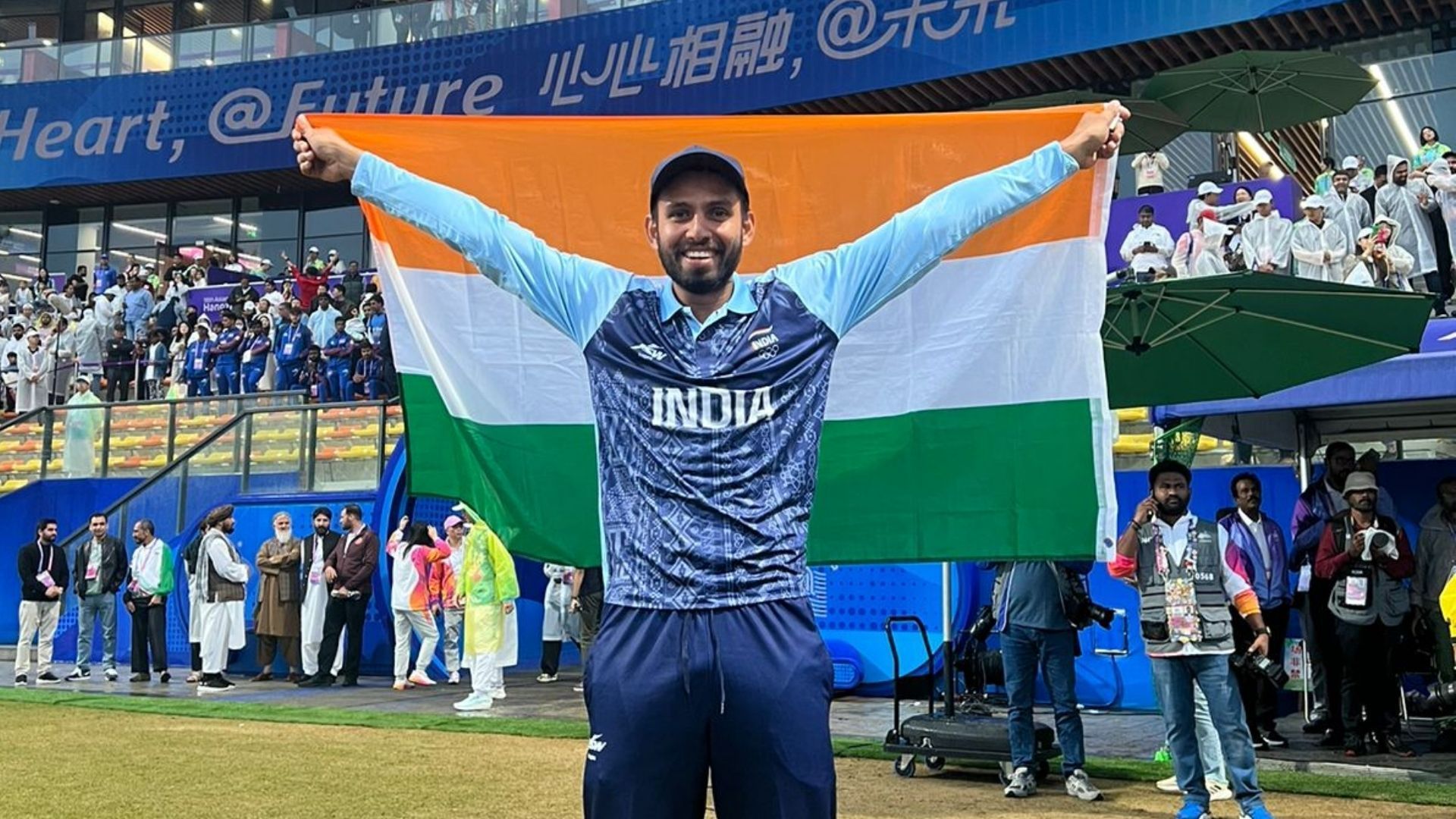 Jitesh Sharma poses with the Indian flag after winning gold in Asian Games 