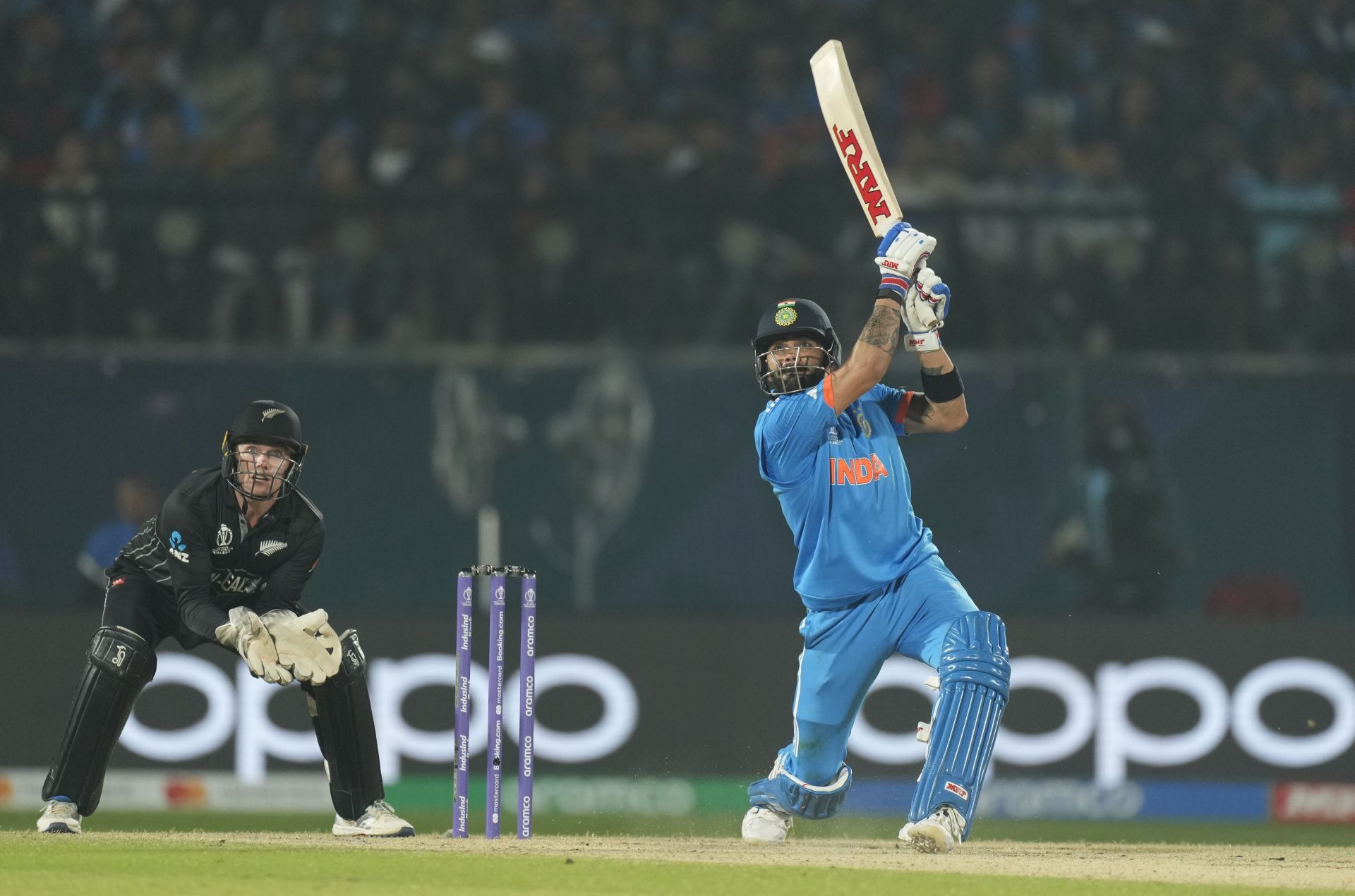 Virat Kohli lofting one to off-side vs New Zealand [Getty Images]