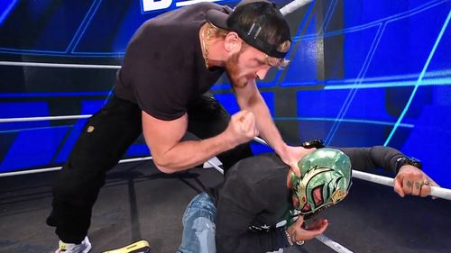 Logan Paul jumping Rey Mysterio on WWE SmackDown.