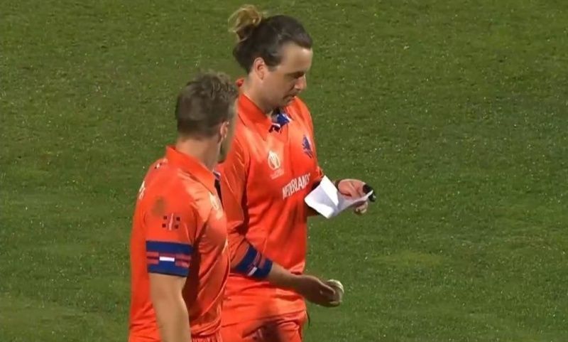 Dutch players check a piece of paper.