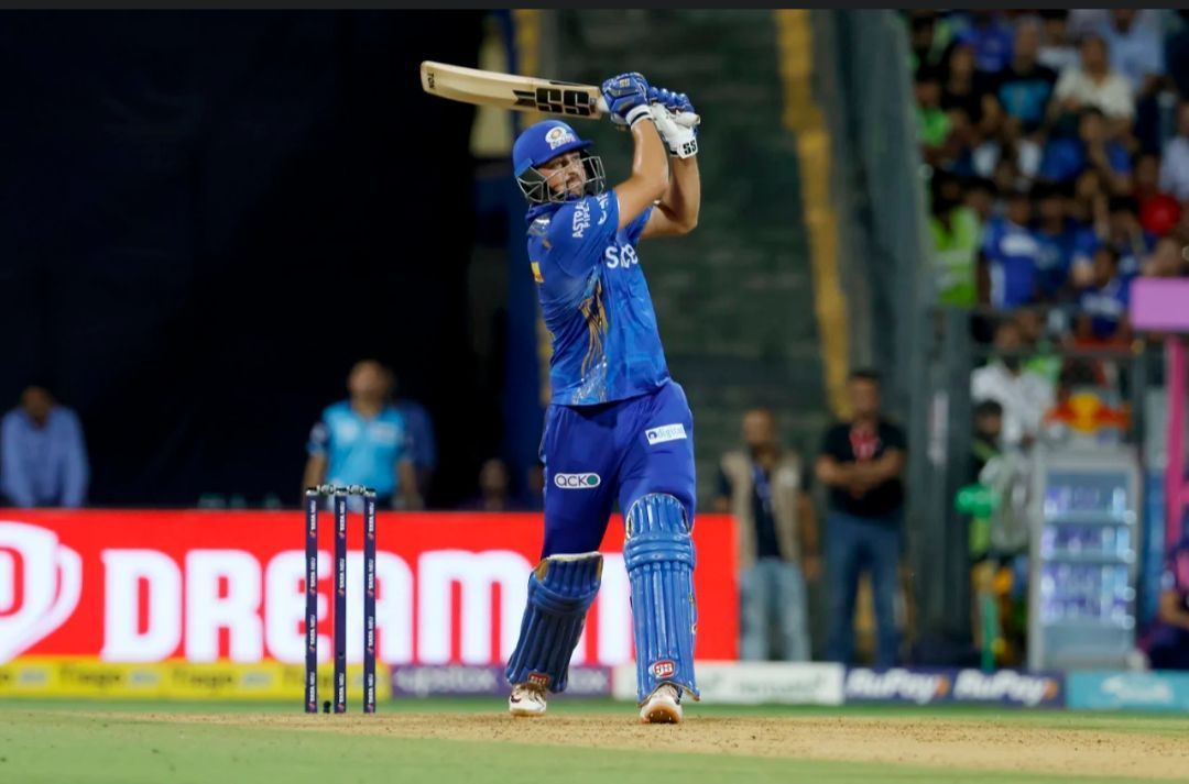Tim David hitting one out of the park for Mumbai Indians [Getty Images]
