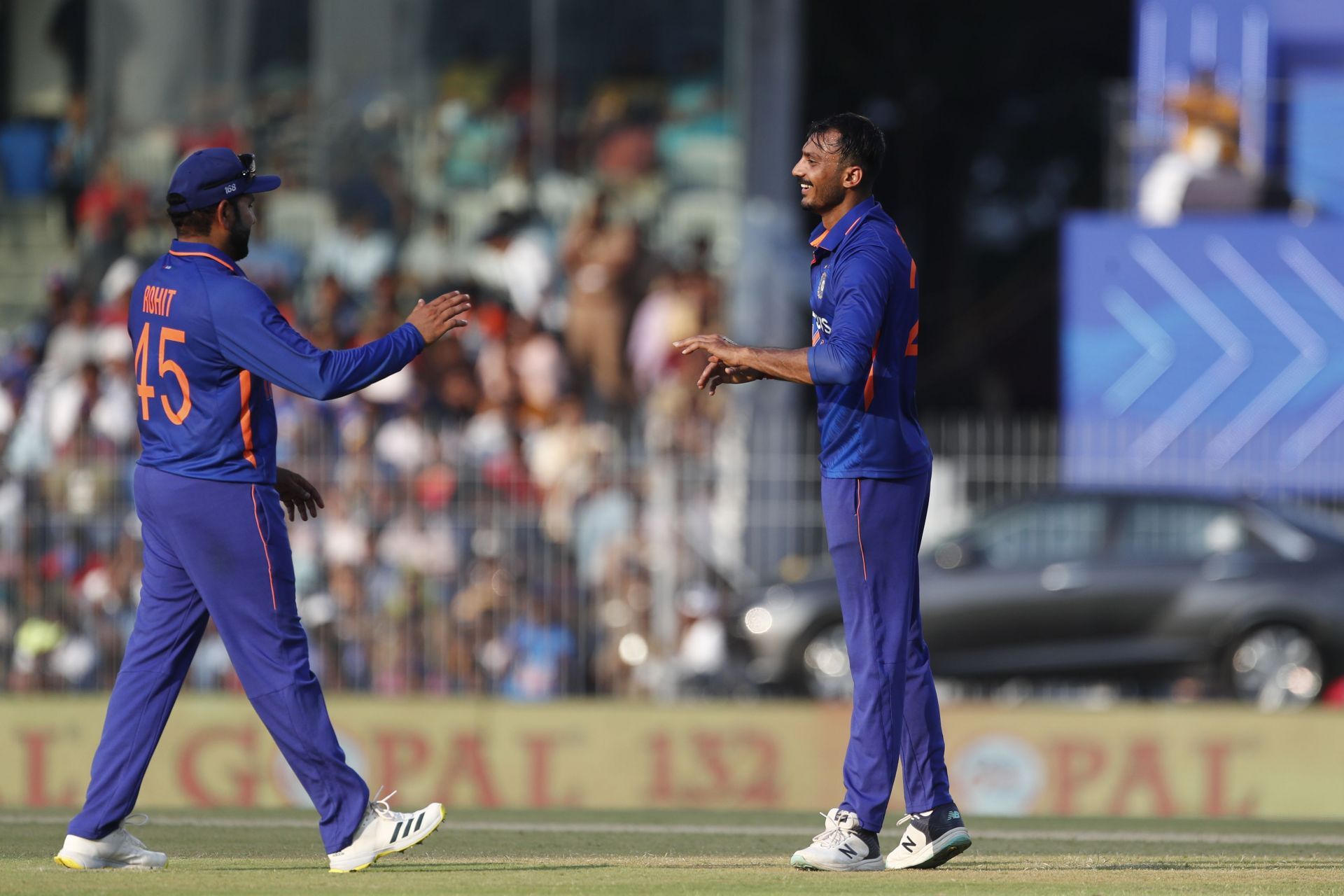 Axar Patel celebrates with Rohit Sharma, India v Australia - 3rd ODI