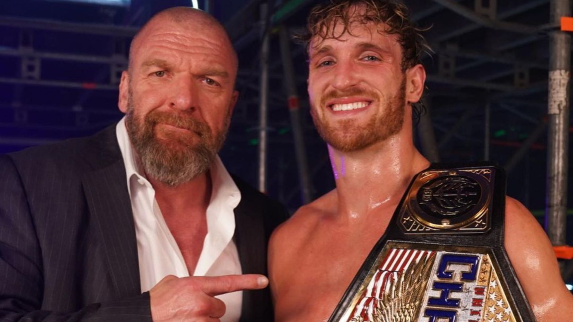 WWE CCO Triple H (left) and the new US Champion Logan Paul (right)