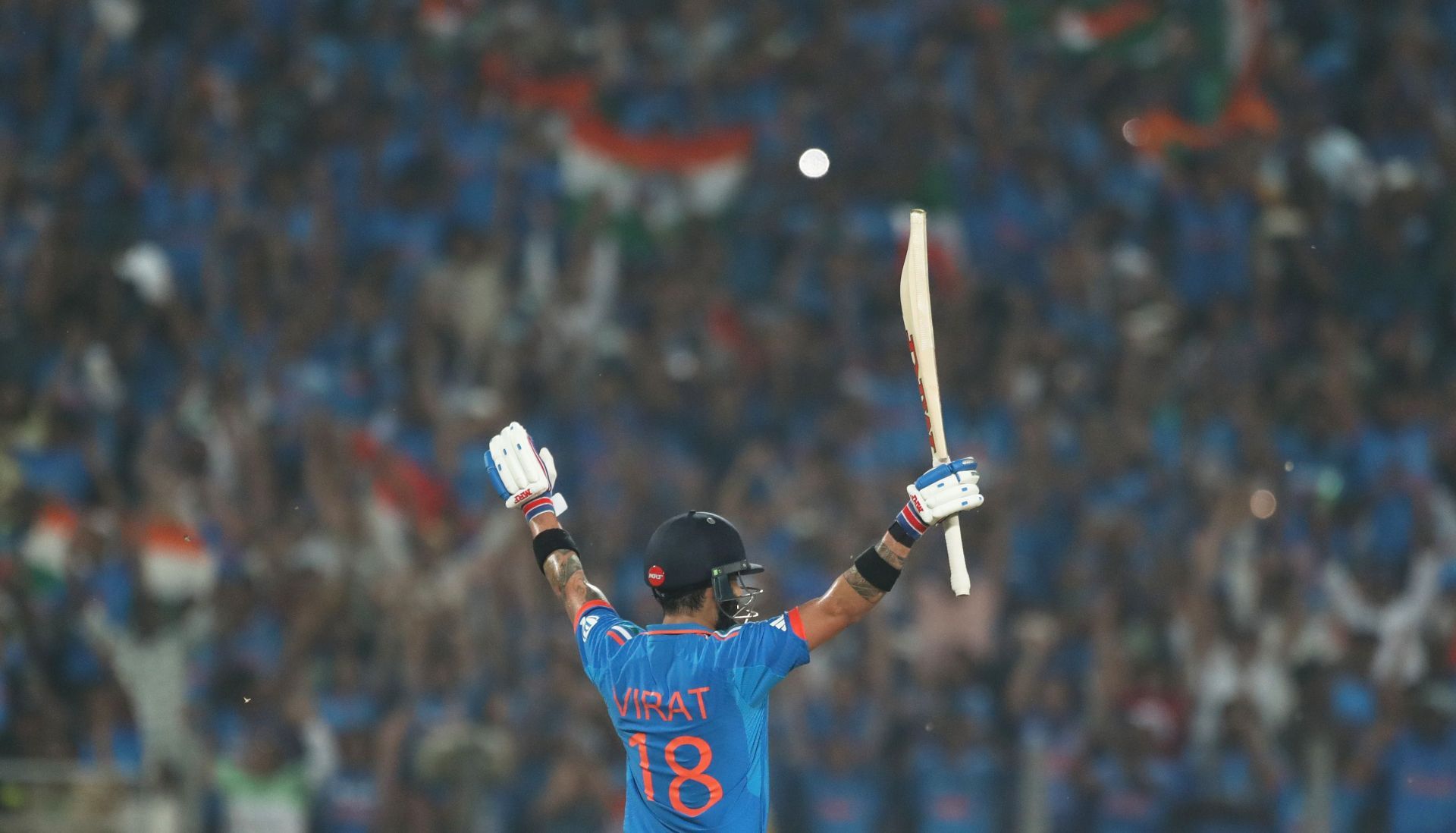 Virat Kohli raising his hands after reaching his century vs Bangladesh. [Getty Images]