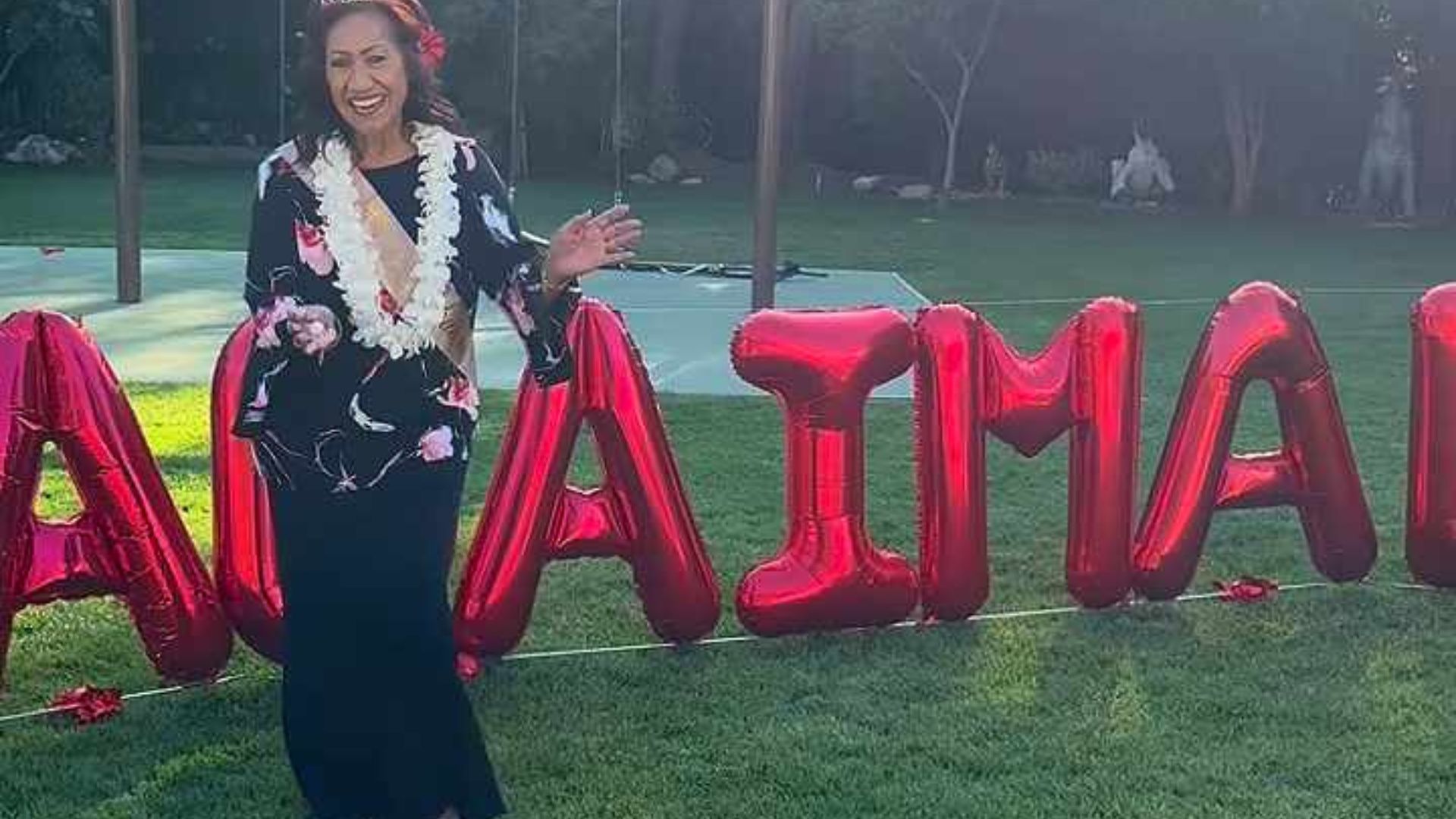 Ata in front of her balloon display for her birthday