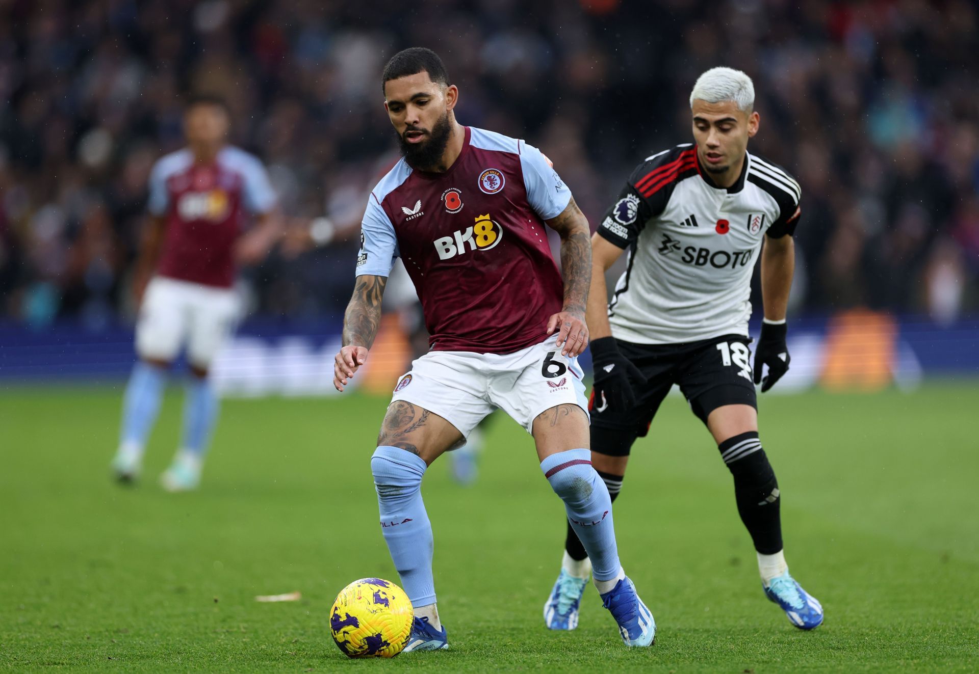 Douglas Luiz (left) has admirers at the Emirates.