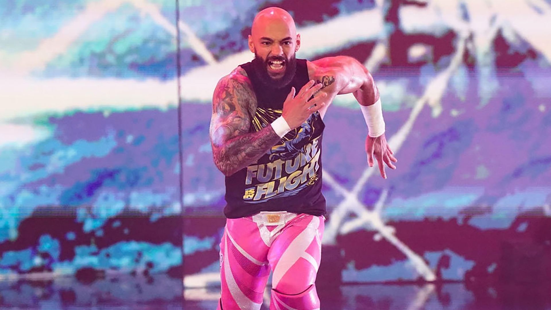 Ricochet runs to the ring on WWE RAW