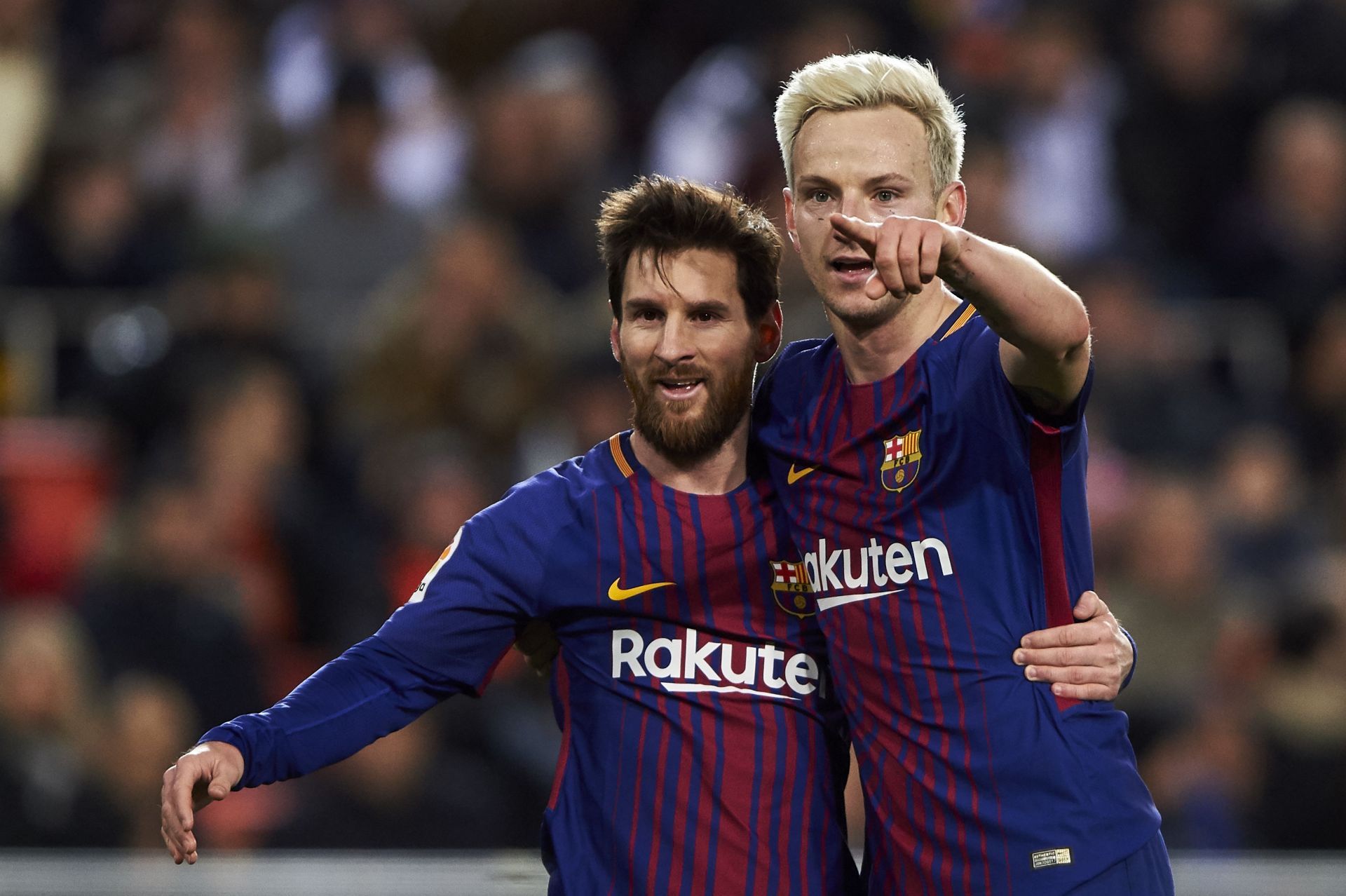 Lionel Messi and Ivan Rakitic (via Getty Images)