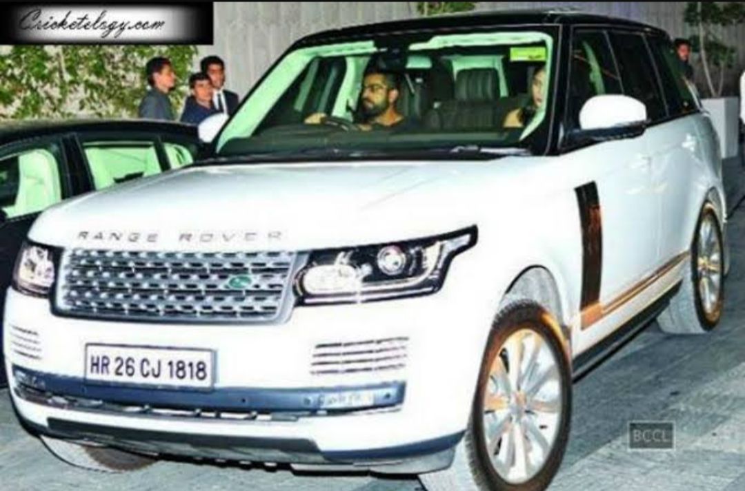 Virat Kohli and Anushka Sharma in the Land Rover car [Cartoq]]