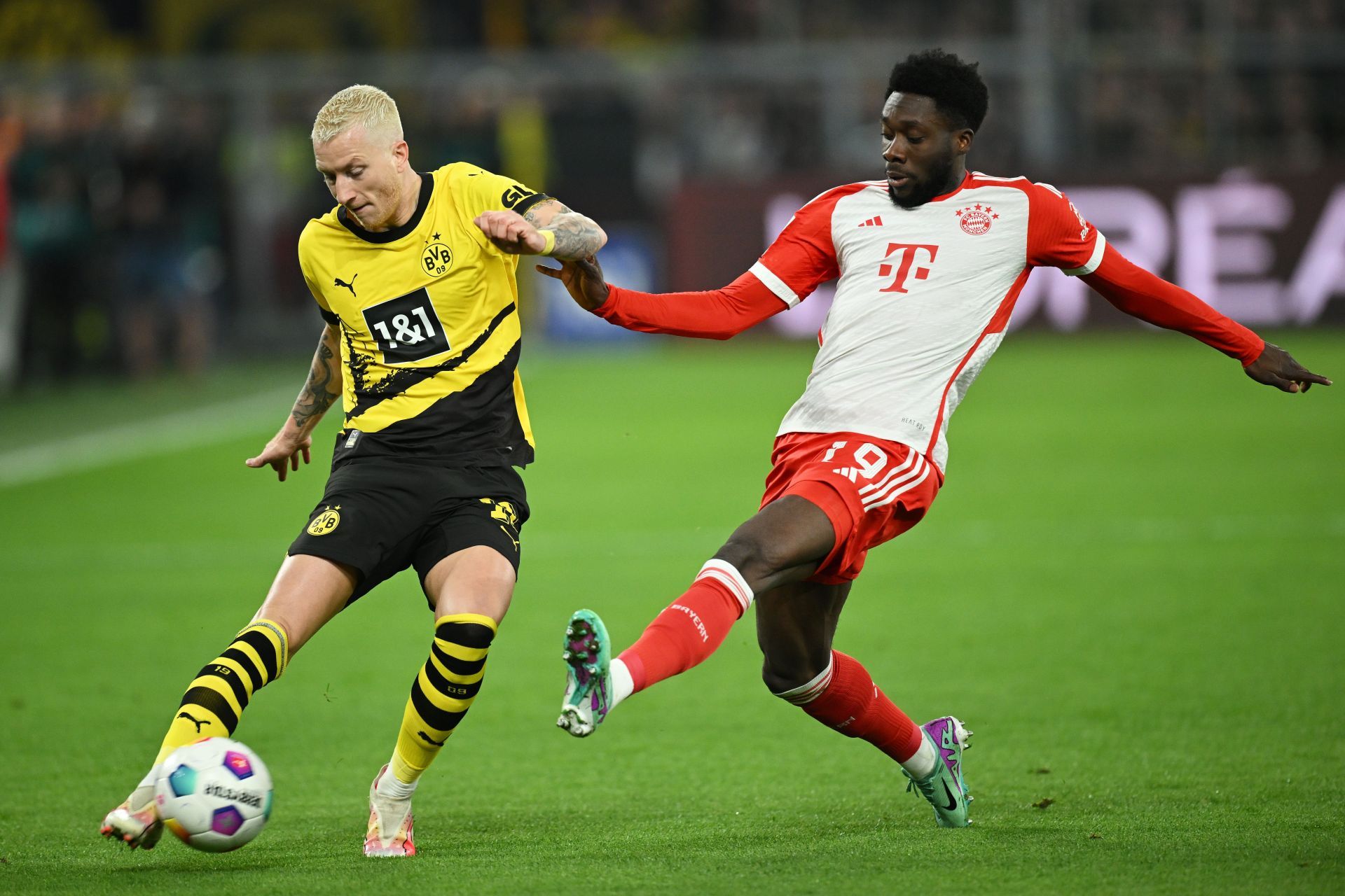 Alphonso Davies (right) is wanted at the Santiago Bernabeu