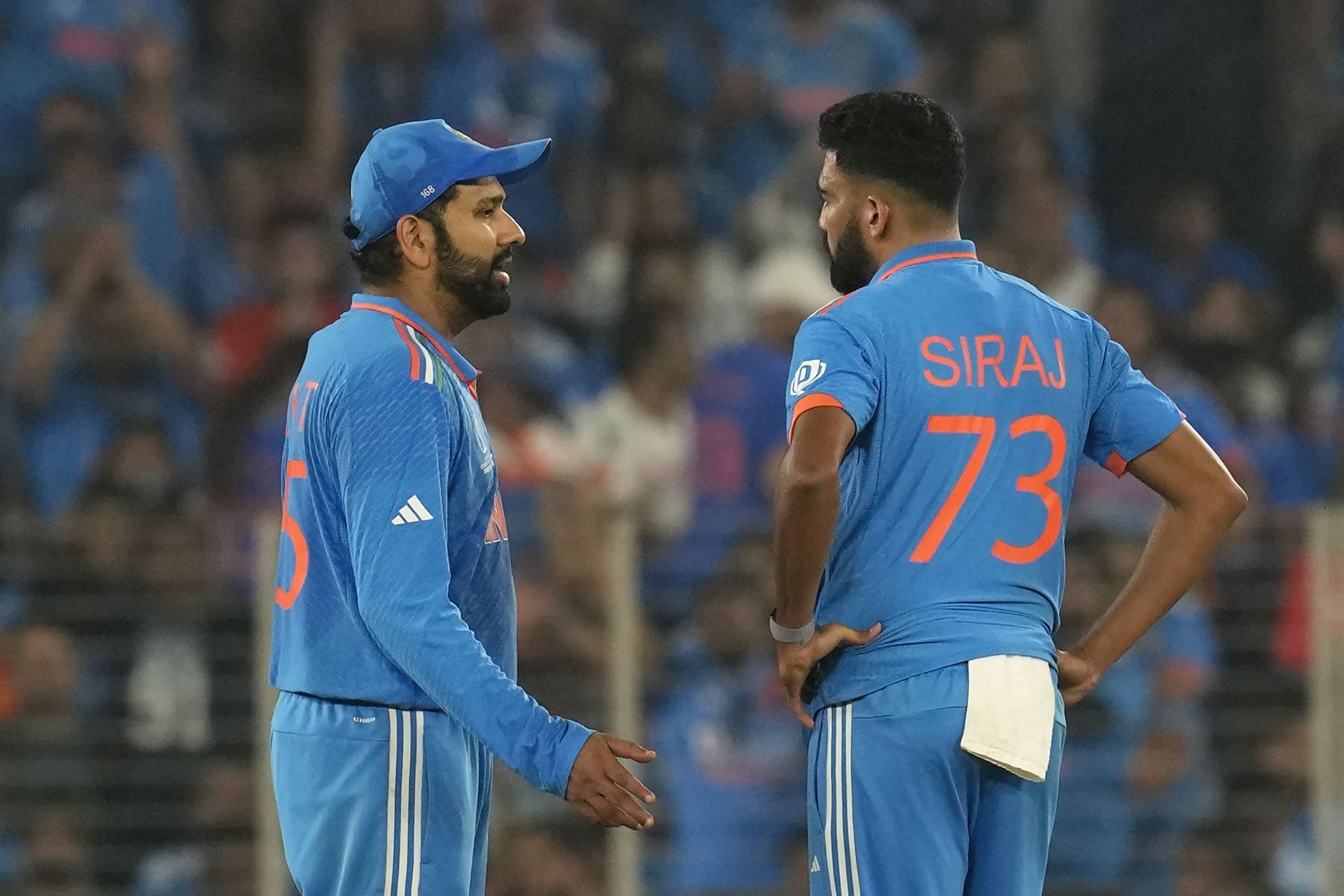Rohit Sharma (left) with Mohammed Siraj (Pic: AP)