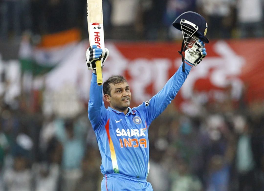 Virender Sehwag acknowledging his milestone [Getty Images]