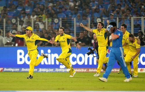 Australian players run to celebrate their 2023 World Cup final triumph over India. (Pic: AP)