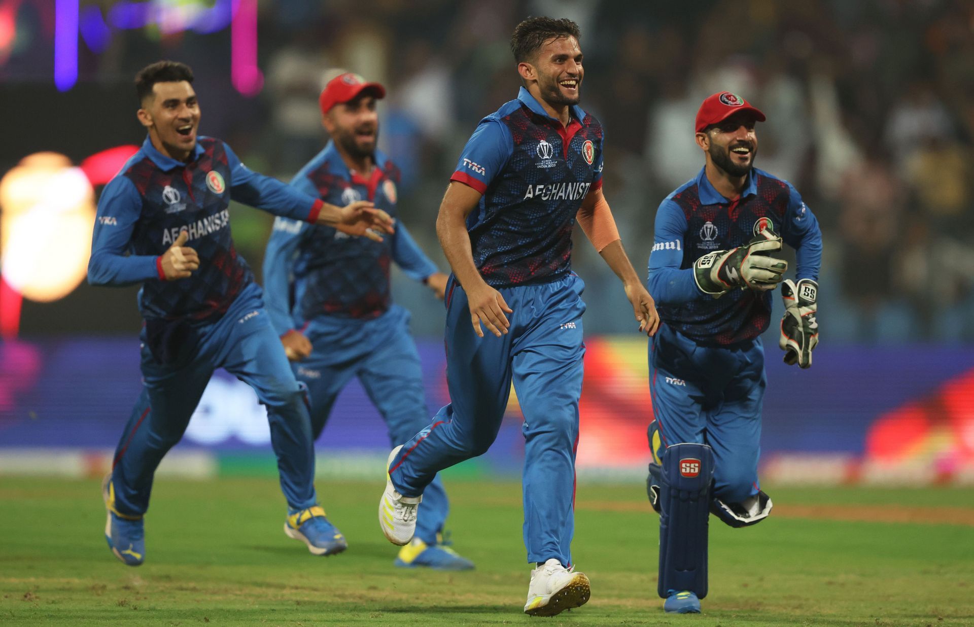 Azmatullah Omarzai and his teammates celebrating vs Australia [Getty Images]