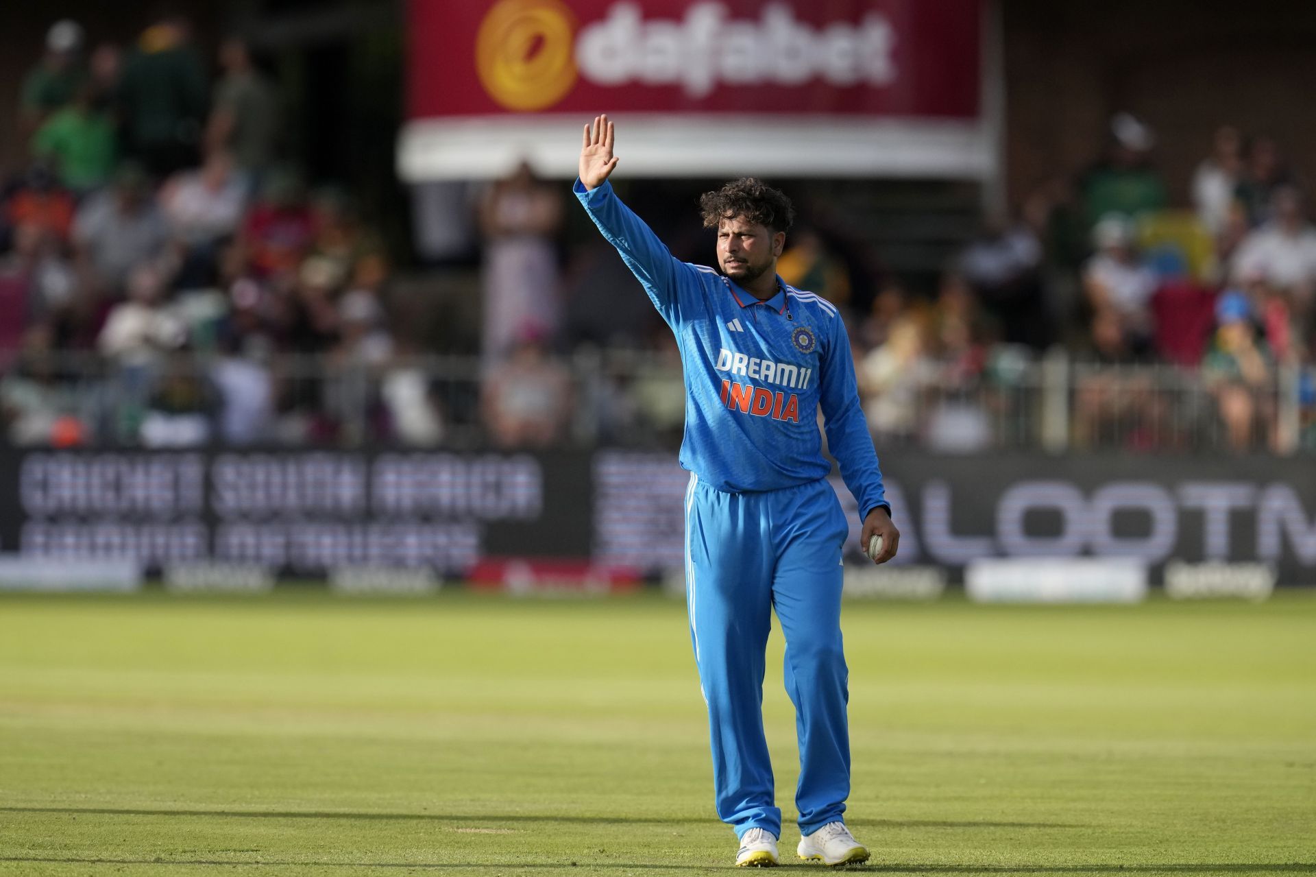 Kuldeep Yadav gesturing on the field.