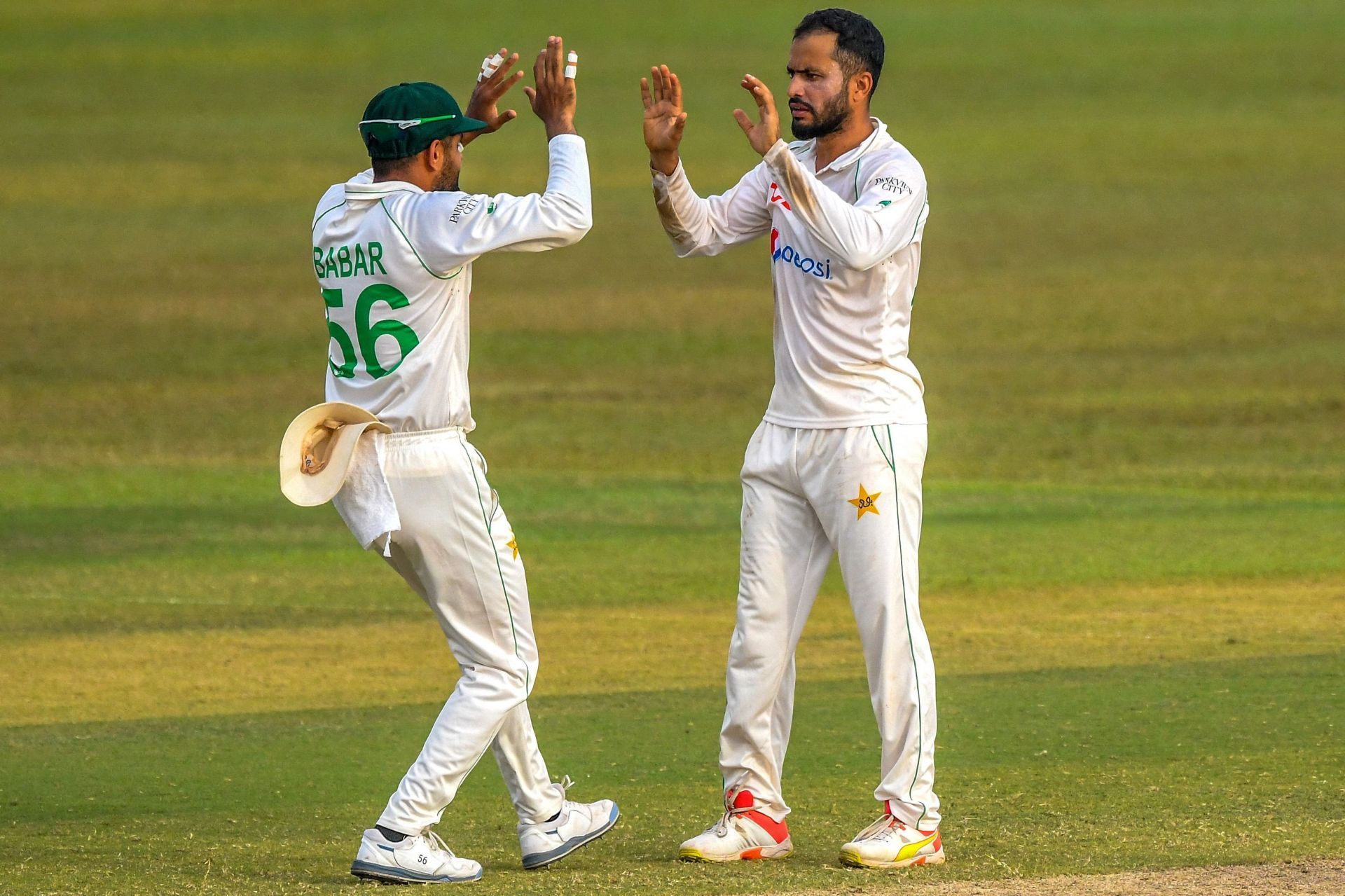 Mohammad Nawaz celebrates a wicket with Babar Azam. (Credits: Twitter)