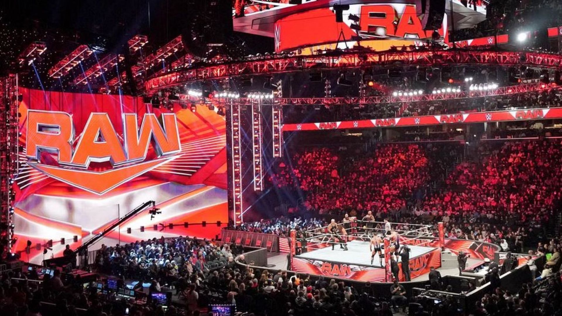 The WWE RAW logos and ring/stage on display inside arena