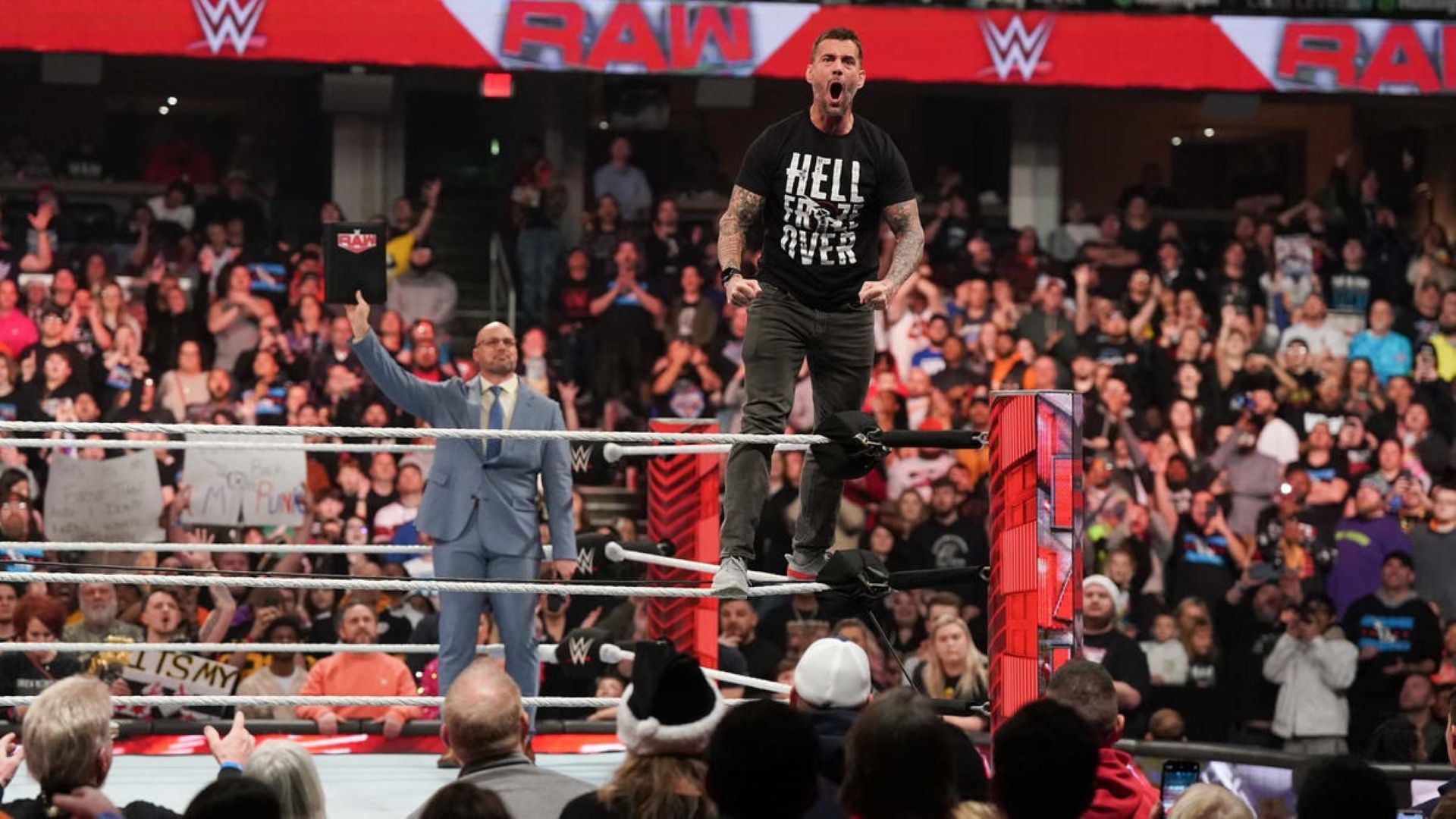 CM Punk poses in the ring on WWE RAW