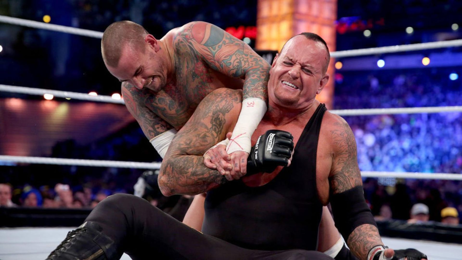 CM Punk and Undertaker during their match. Image Credits: X