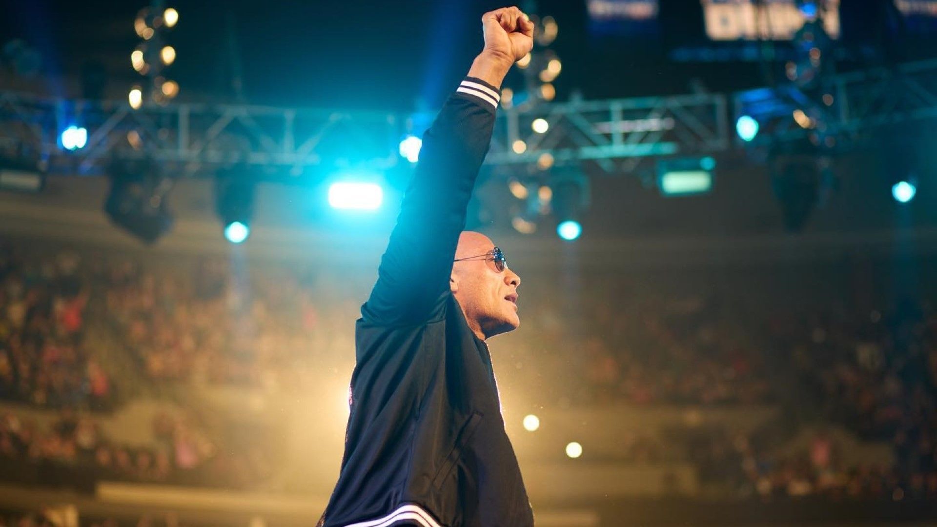 The Rock poses in the WWE SmackDown ring