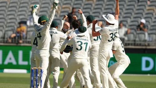 Australian players rejoice in Nathan Lyon's 500th Test wicket.