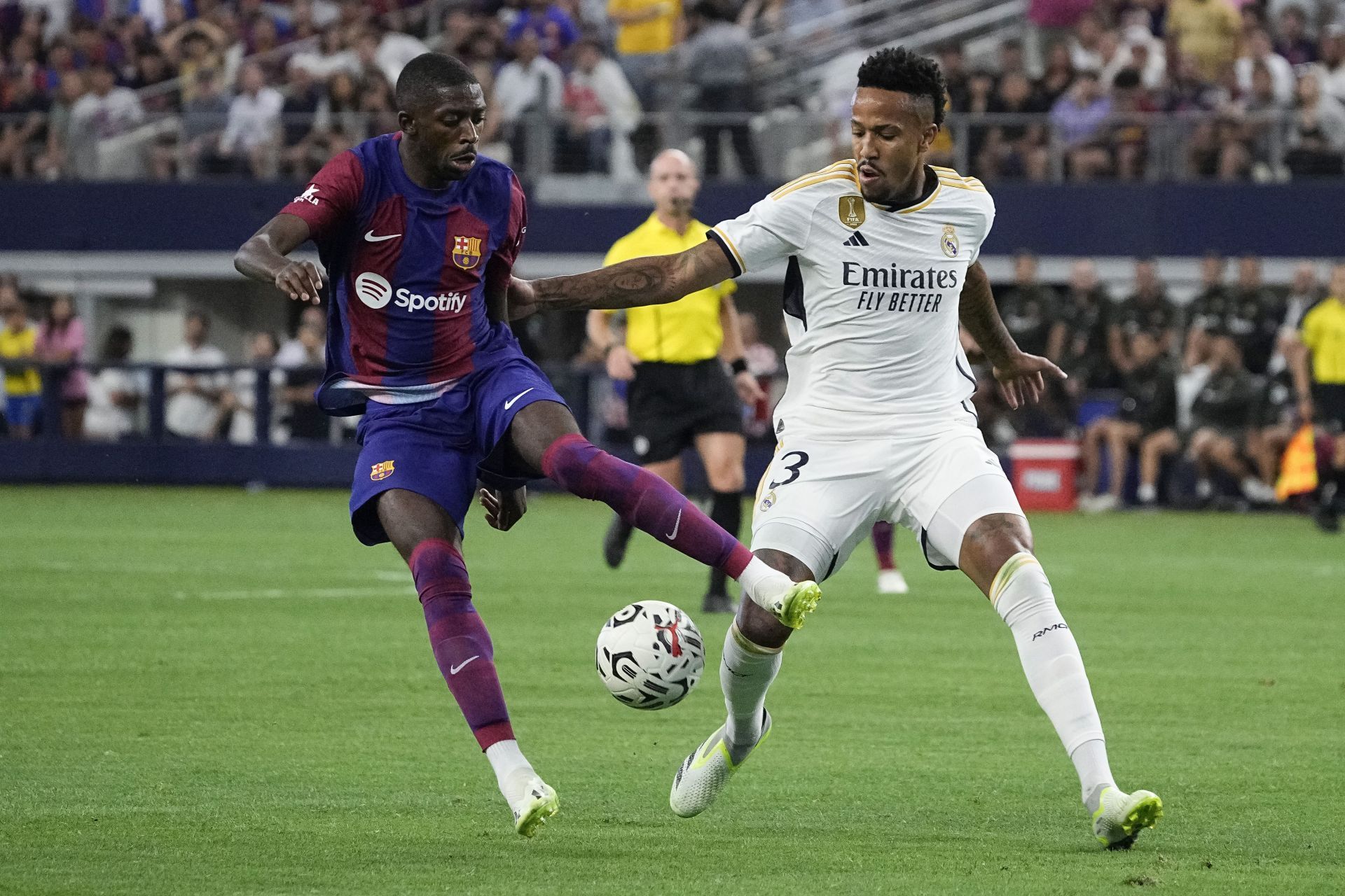 Eder Militao (right) is set to stay at the Santiago Bernabeu.