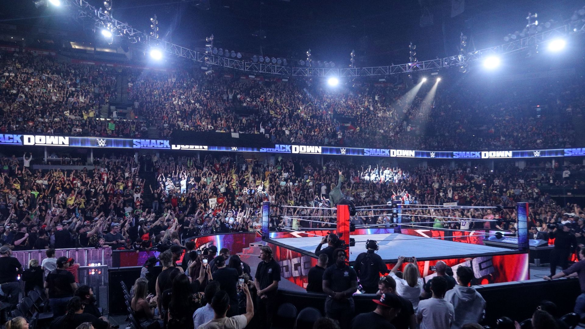 WWE fans look on from a packed crowd