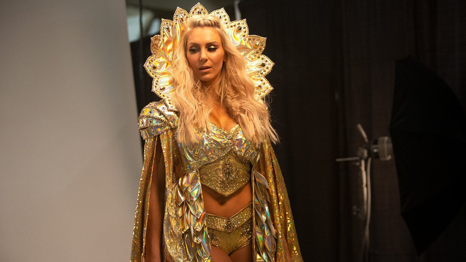 Charlotte Flair poses backstage at a WWE photo shoot