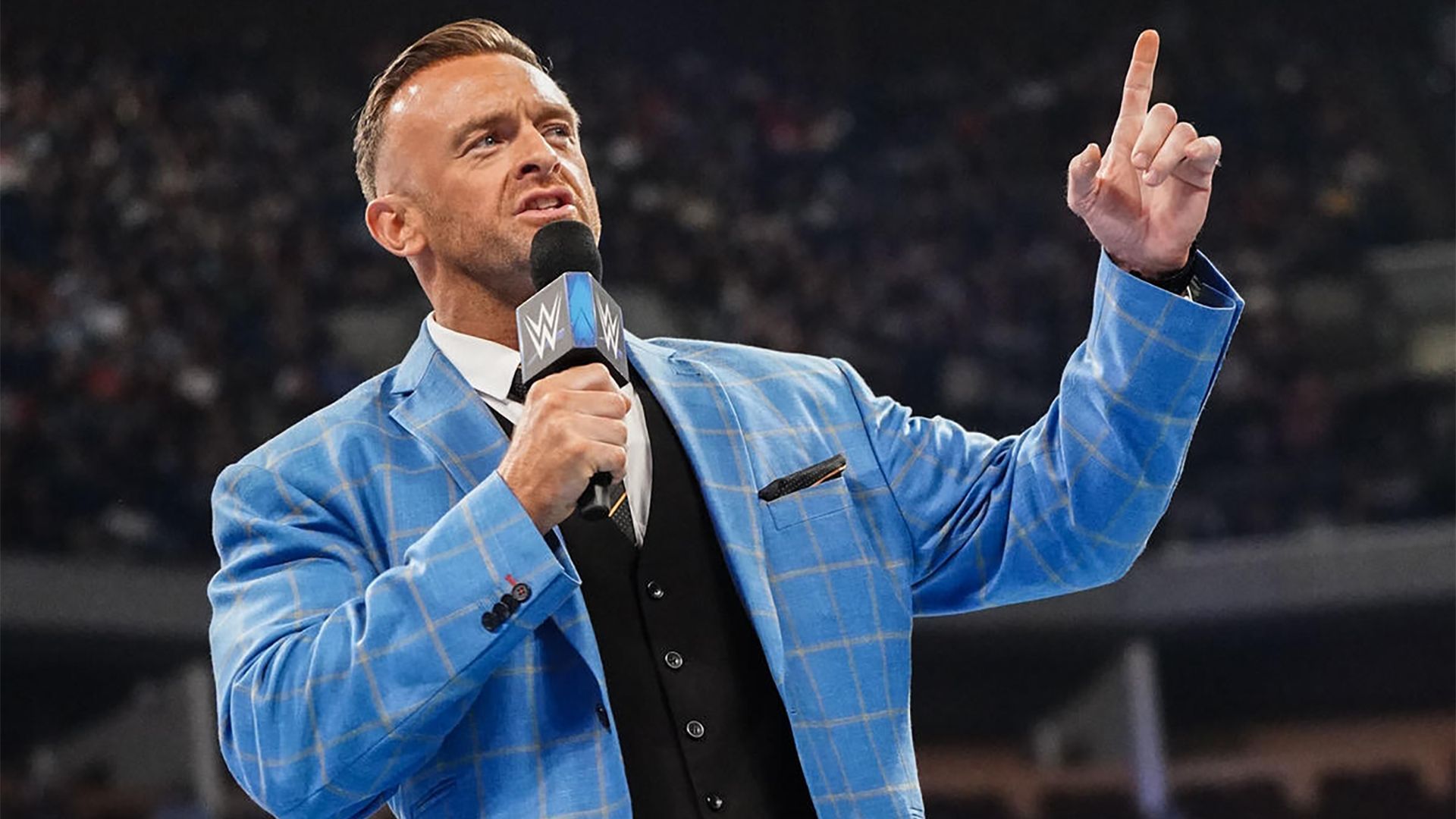 WWE SmackDown General Manager Nick Aldis speaks from the ring