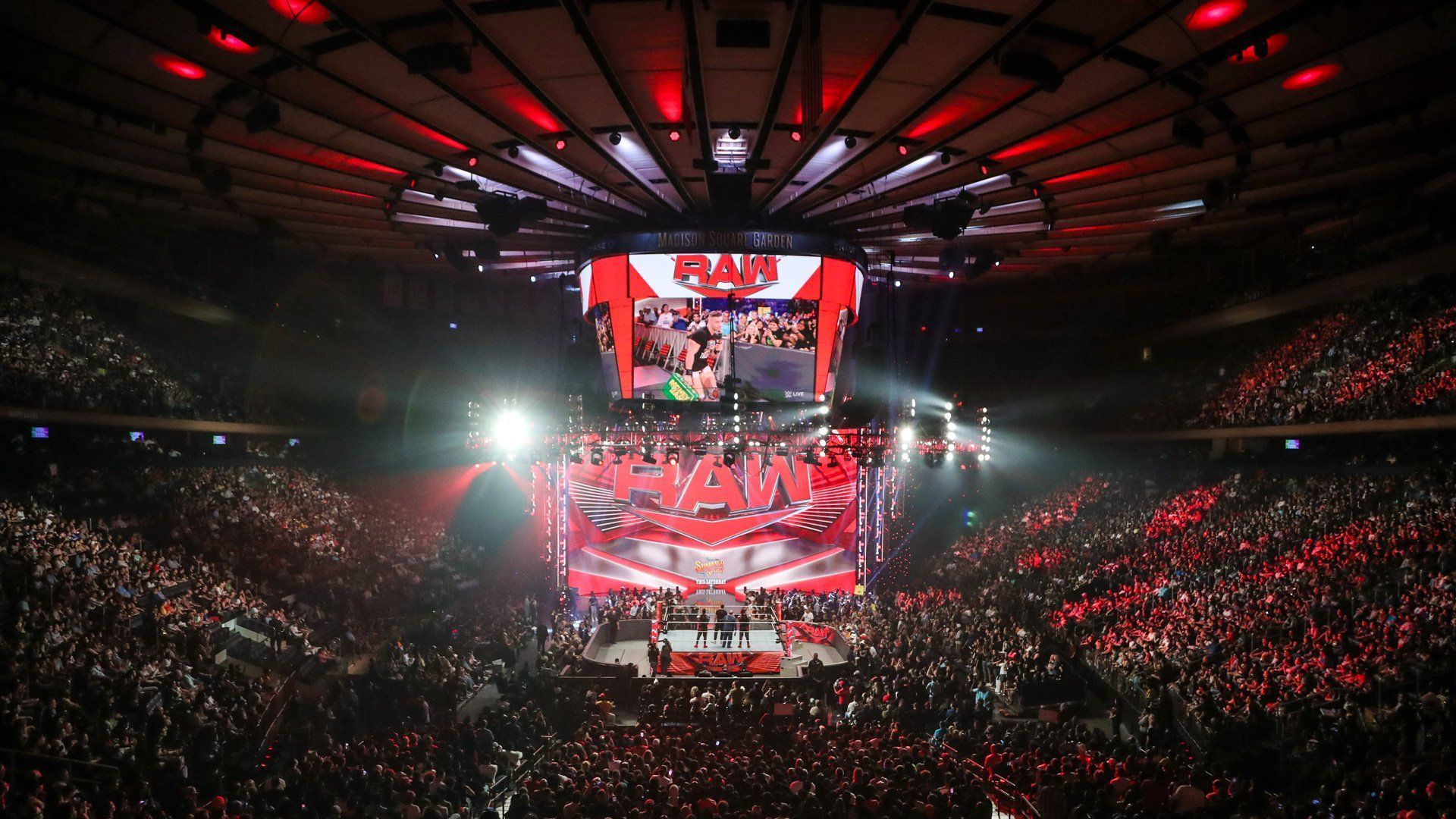 The WWE RAW ring and stage/set inside a packed arena