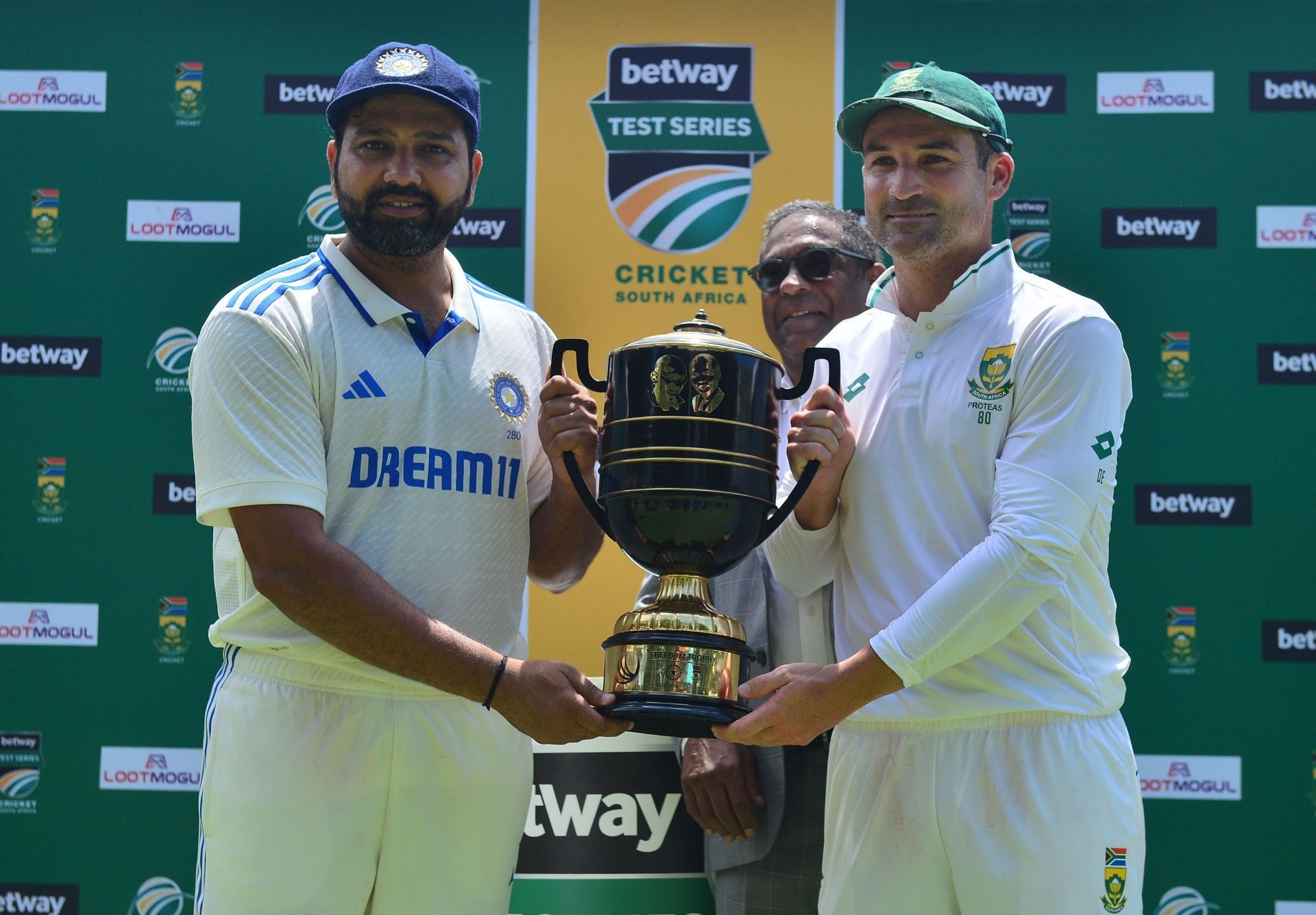Rohit Sharma and Dean Elgar pose with the trophy after the South Africa vs India - 2nd Test