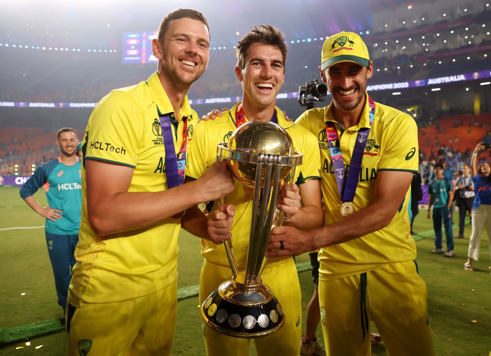 Josh Hazlewood, Pat Cummins and Mitchell Starc with the 2023 World Cup trophy